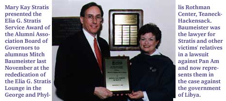 Mary Kay Stratis presents Mitch Baumeister with the Elia G. Stratis Service Award