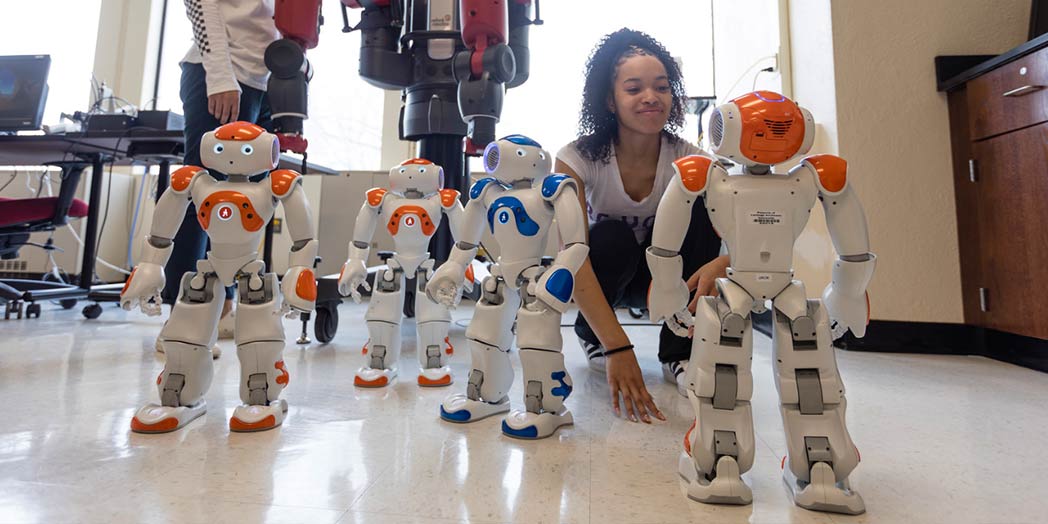 students working on robots