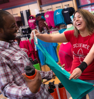 students looking at shirts in the bookstore