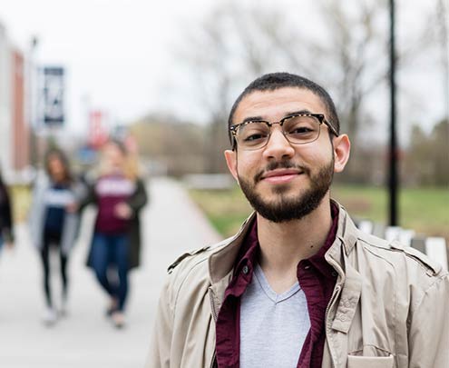 student smiling on campus