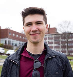 student smiling on campus