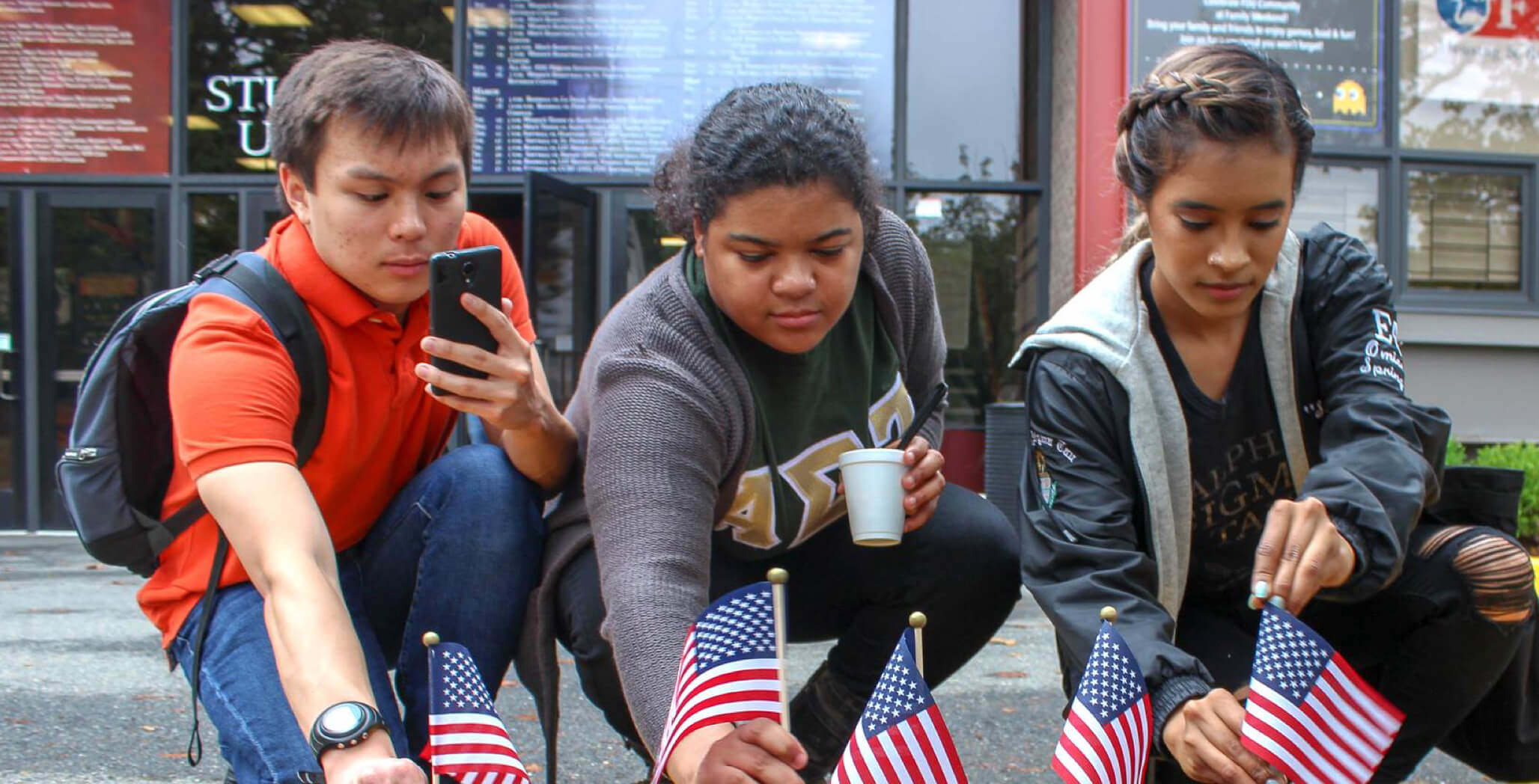 students planting American flags