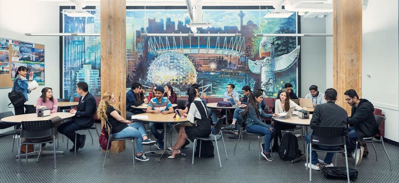 students sitting in a building on vancouver's campus