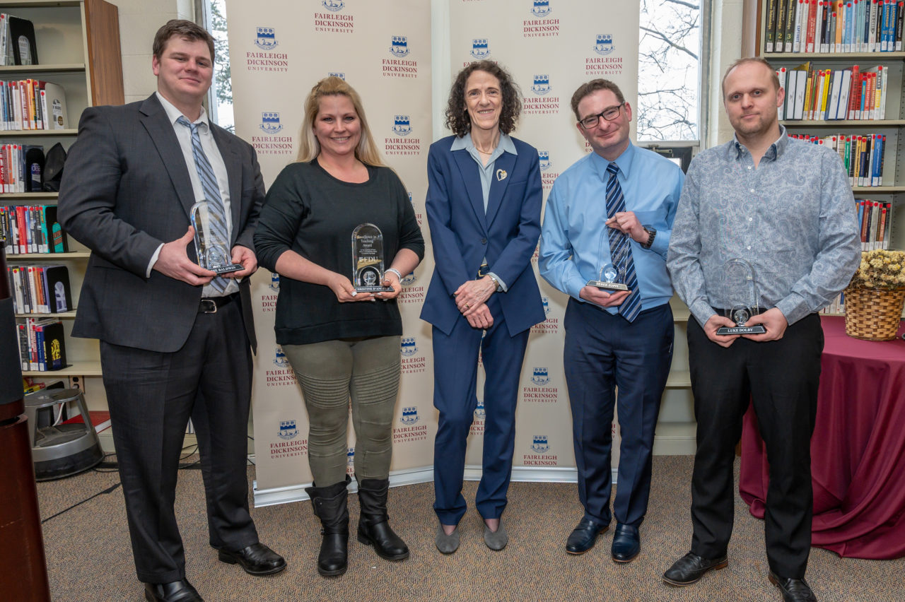 Four high school teachers with awards