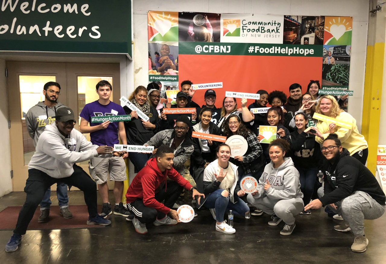 group of students volunteering a community food bank