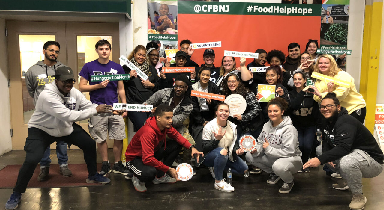 group of students volunteering a community food bank