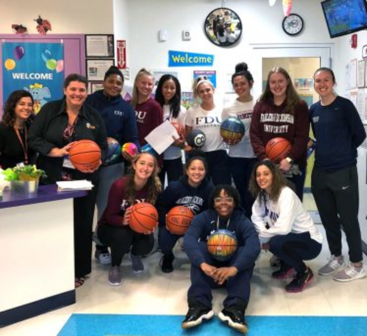 The Knights women’s basketball team volunteers at the Learning Experience