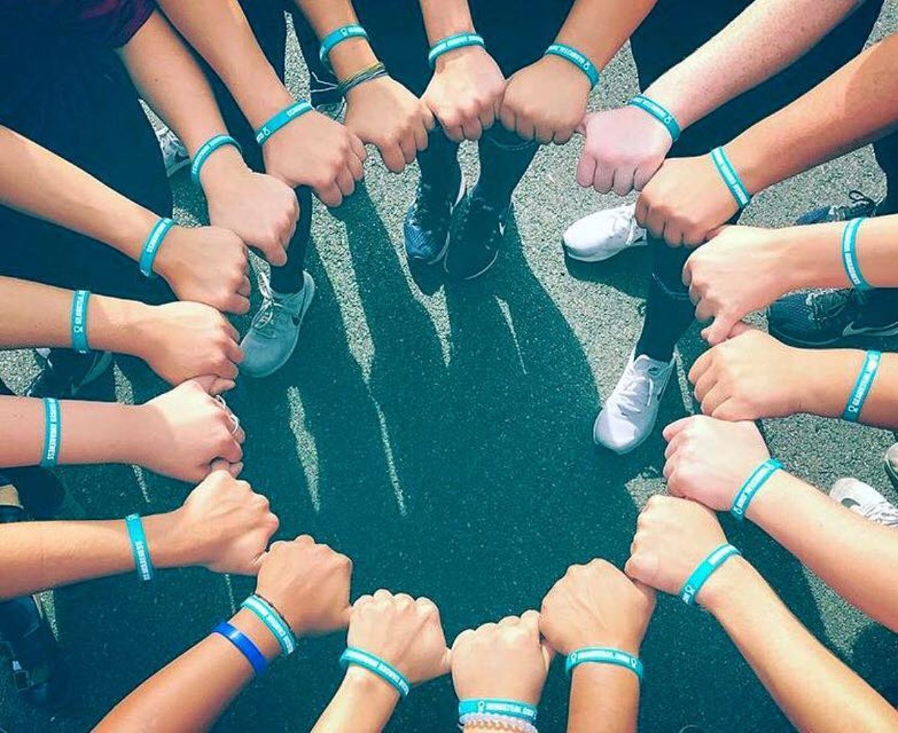 Knights softball team links hands with matching bracelets