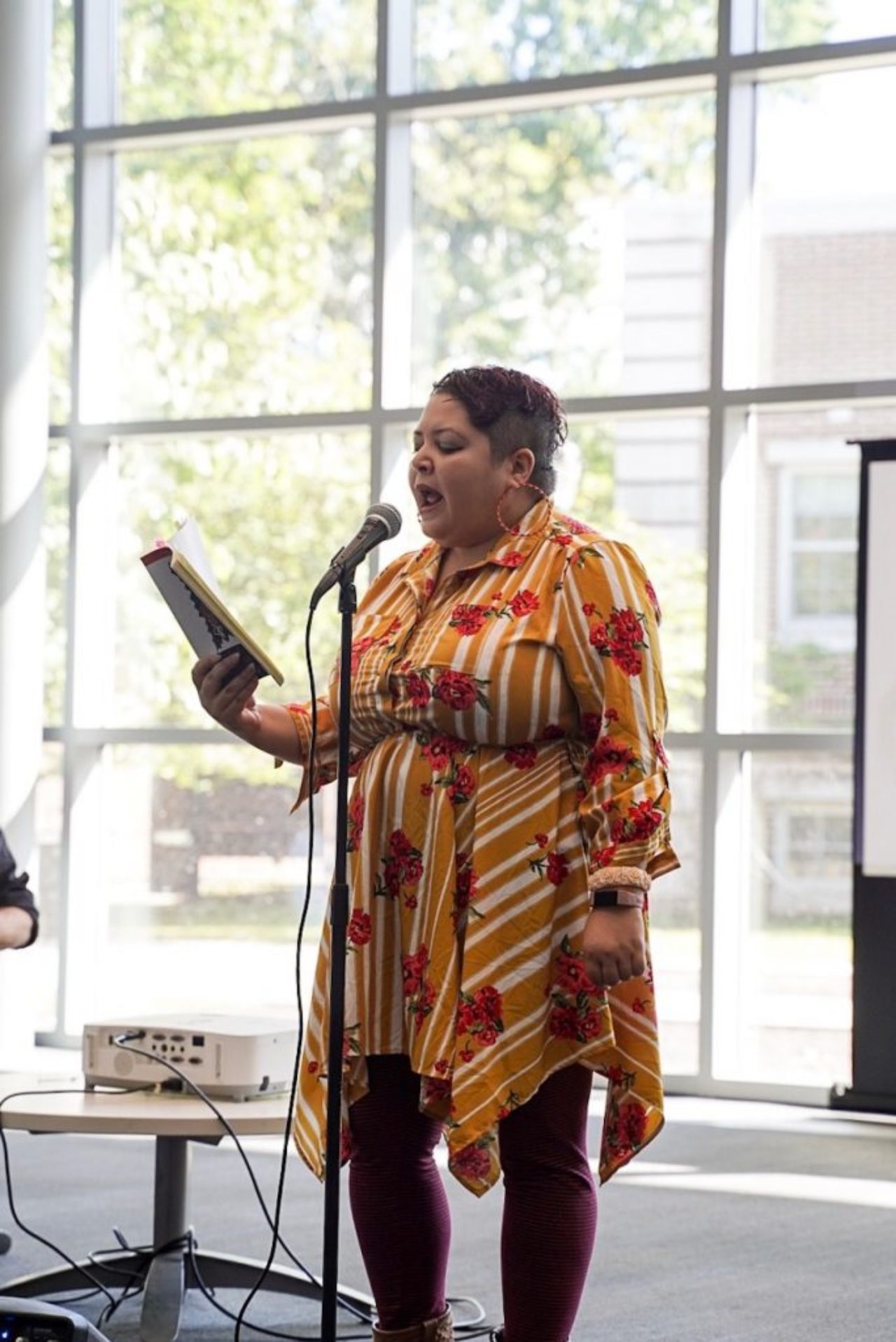 Arts by the People’s Ysabel Gonzales recites a poem.
