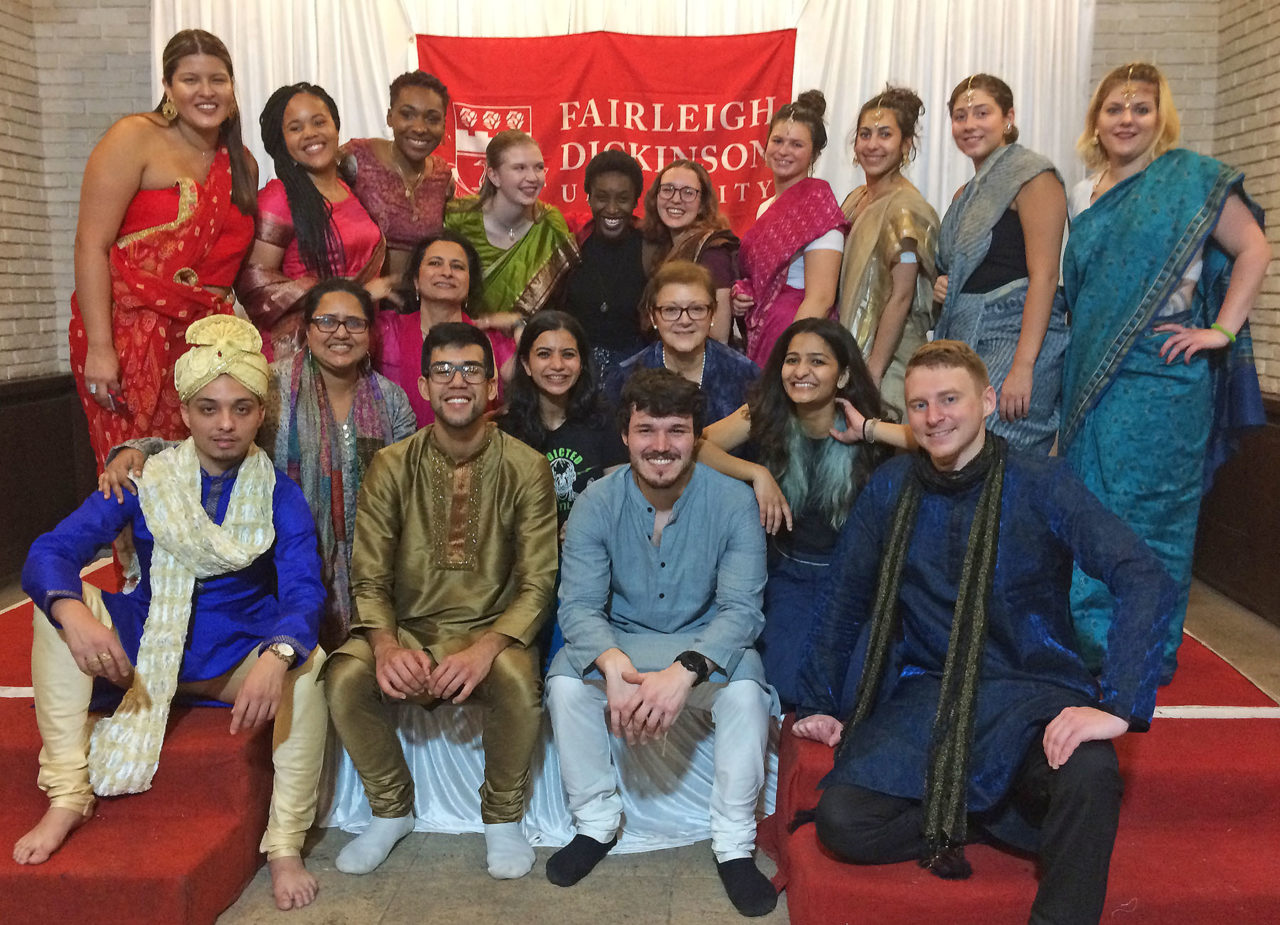 students and faculty wearing pieces of traditional Indian clothing
