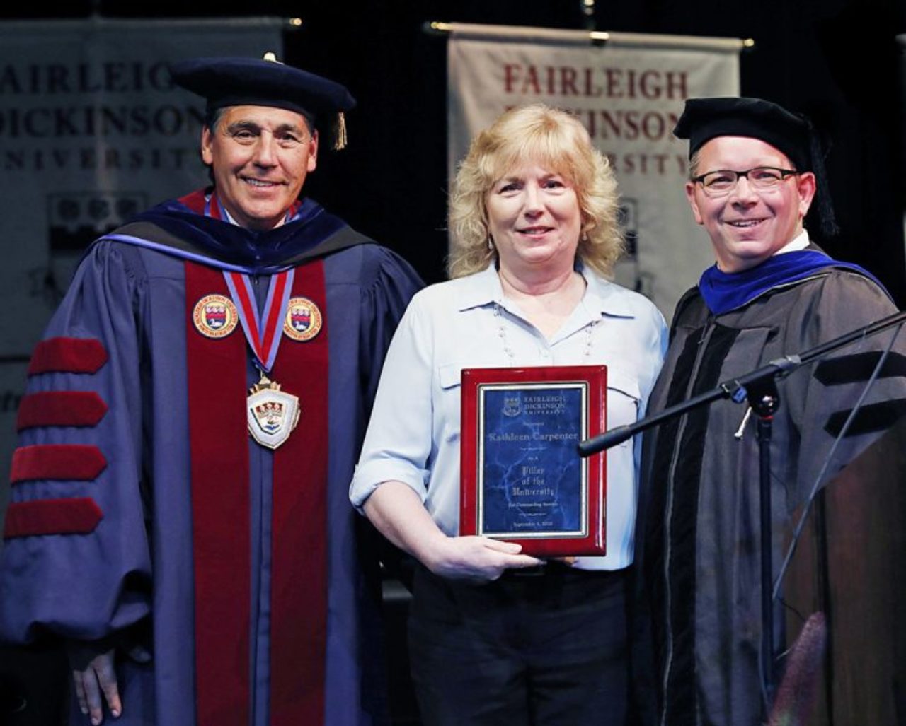 Katie Carpenter, flanked by University President Christopher Capuano and Florham Campus Executive Brian Mauro, was honored as a Pillar of FDU