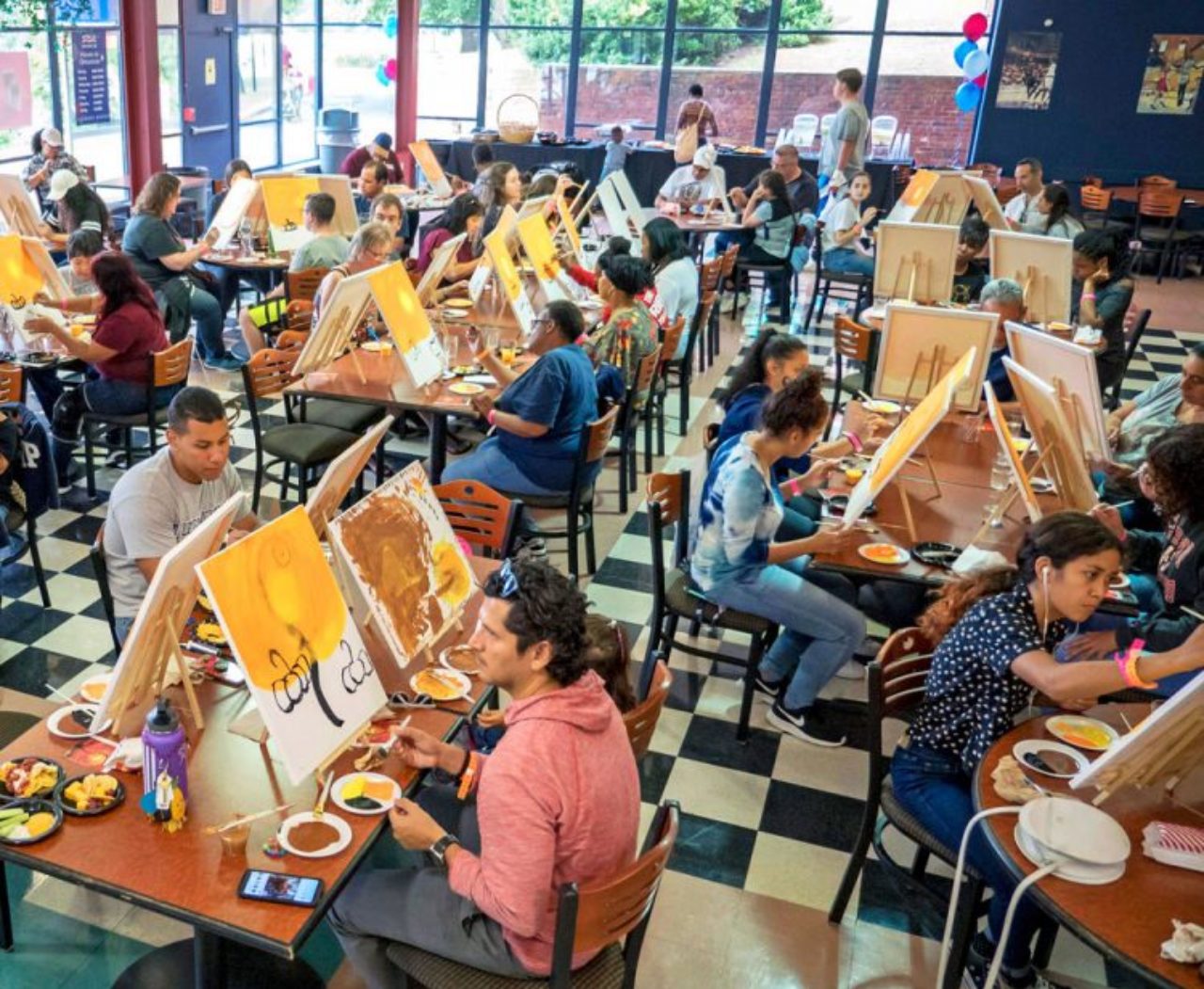 people painting fall-themed art