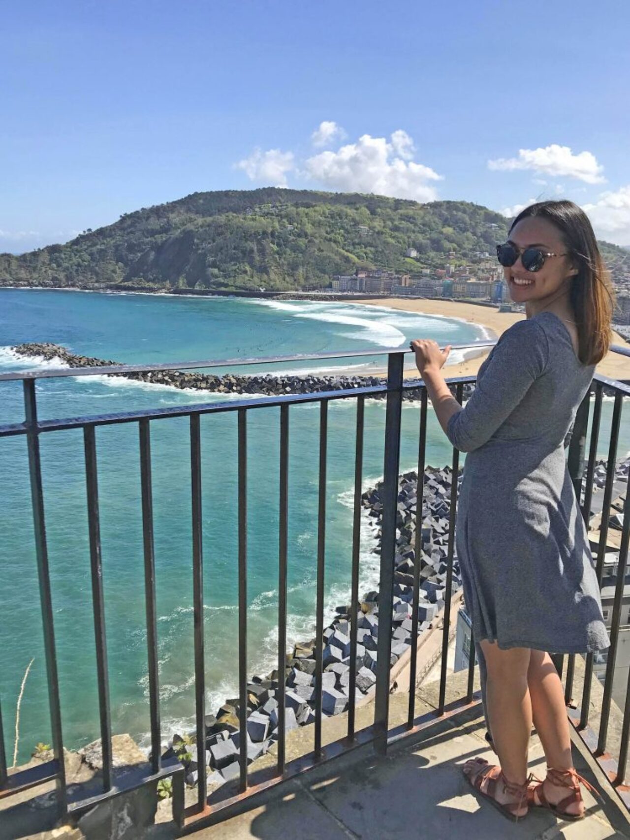 Ediza Koch on balcony looking over ocean