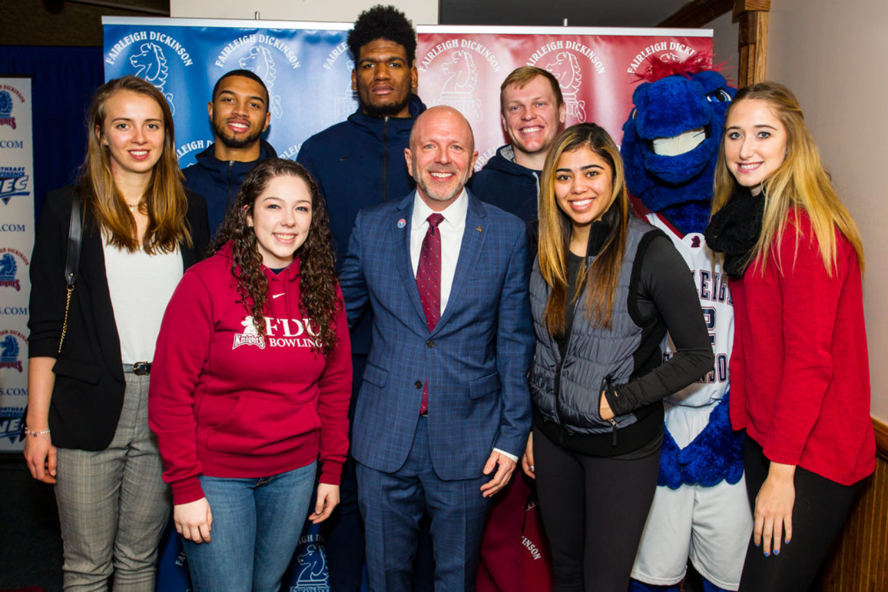 Hurlbut with several student-athletes.