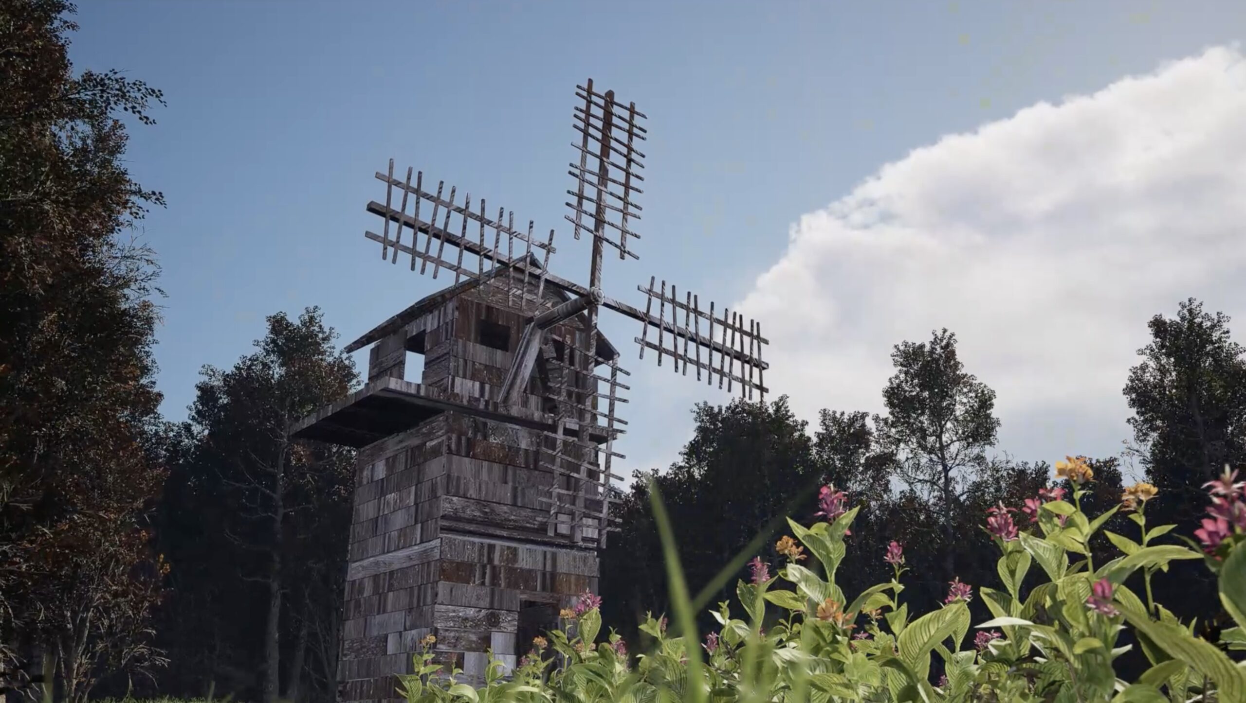 Animated windmill scene with flowers, trees, and blue sky.