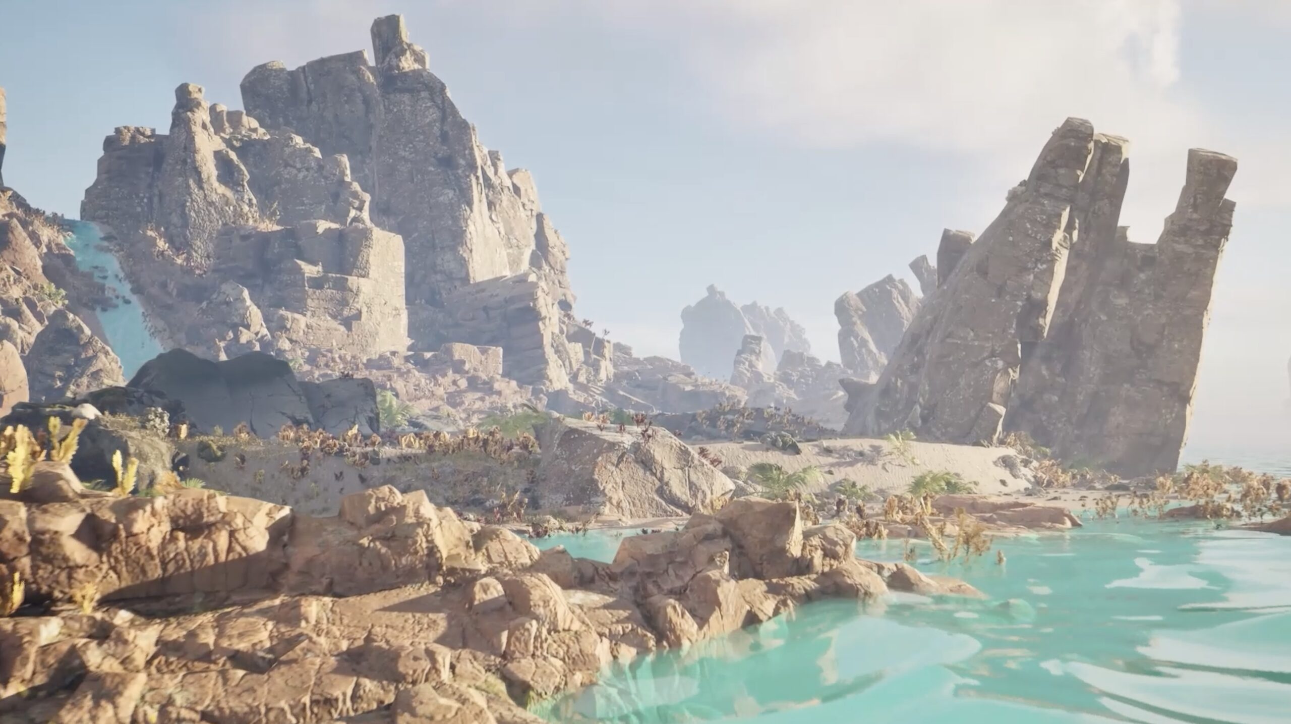 Animation scene with rocky landscape and turquoise water.
