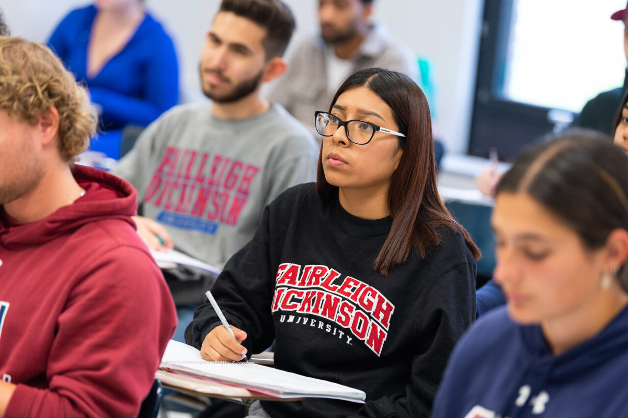 Students take notes and listen in class.