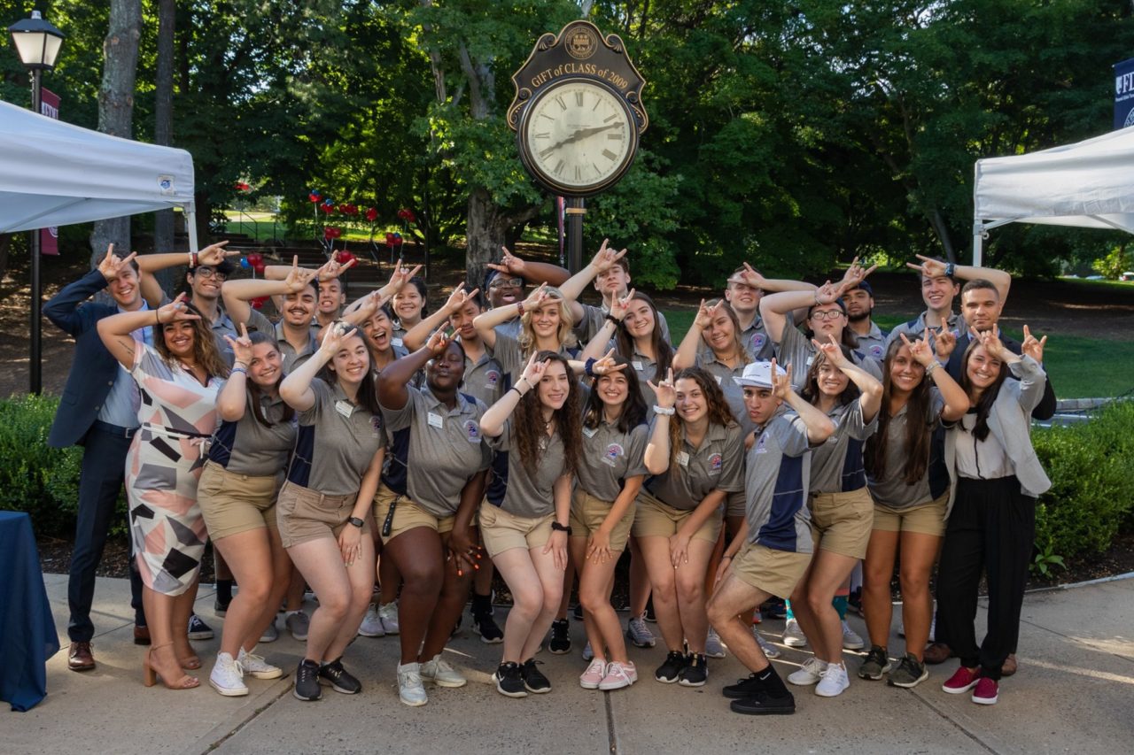 Group of students display the FDU horns.