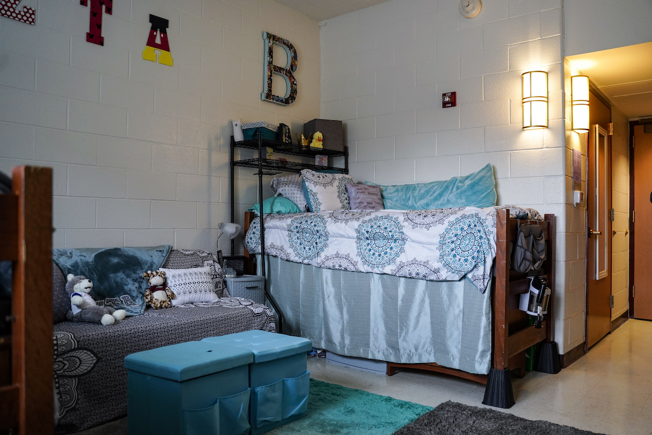 Photo of a bed in a dorm room.