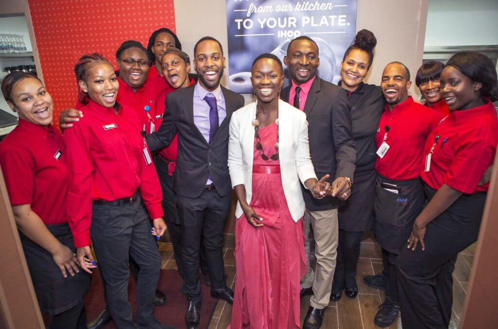 A group of IHOP employees pose for a photo.