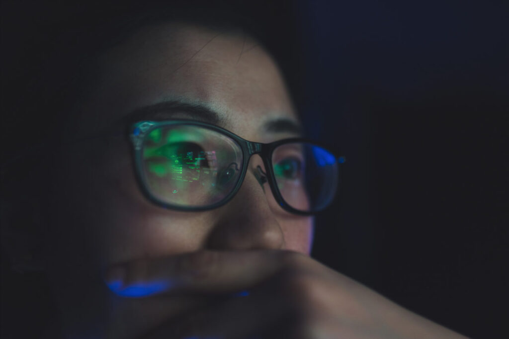 Woman intensely reading a computer screen.