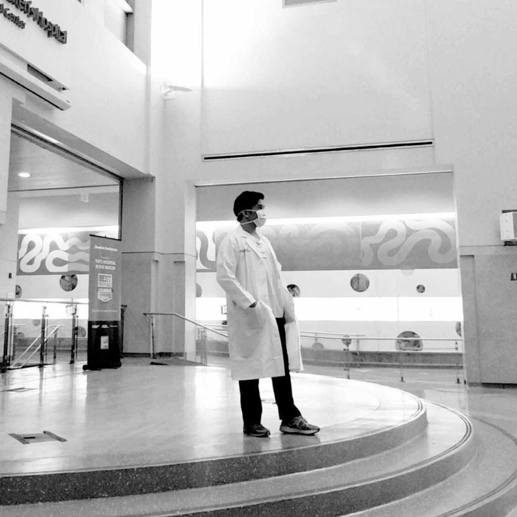 Lester Castor stands and observes a quiet moment in the hospital he works at.