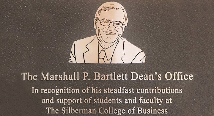 A photo of the plaque featuring Marshall P. Bartlett and his name.