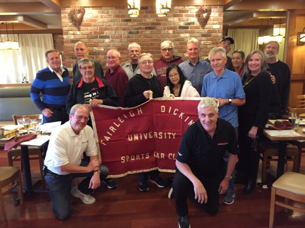 The Fairleigh Dickinson University sports car club posed together for a photo during their reunion in 2019. 