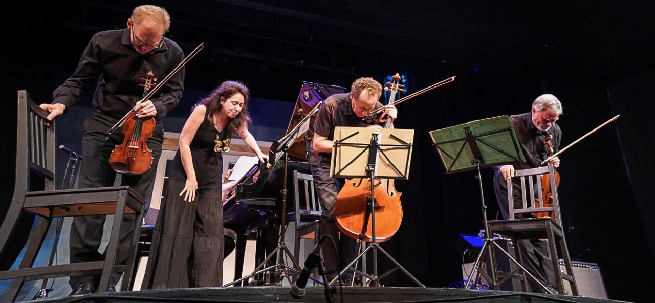 Musicians from the 2019 Wamfest event take a bow on stage.