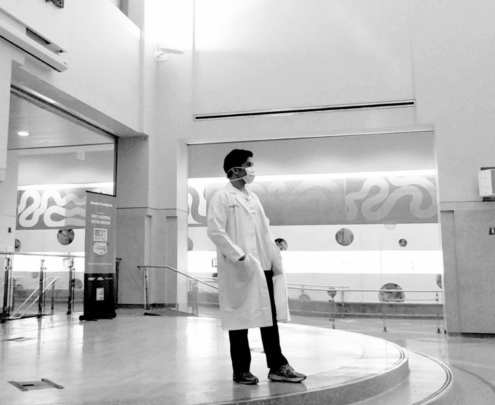 Lester Castor stands and observes a quiet moment in the hospital he works at.