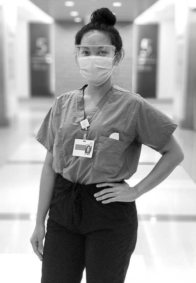 A portrait of Lecille Desampardo, taken in the hallway of the hospital where she works.