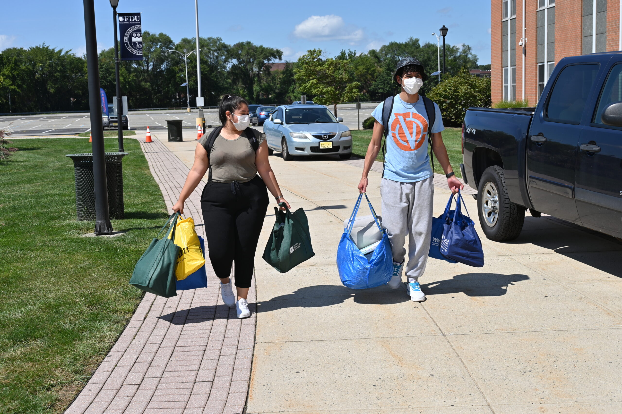 Students carry items.
