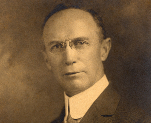 A vintage portrait of a man, circa the early 1900s.