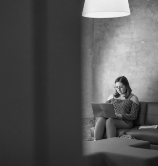 Portrait of a student studying all alone on a laptop