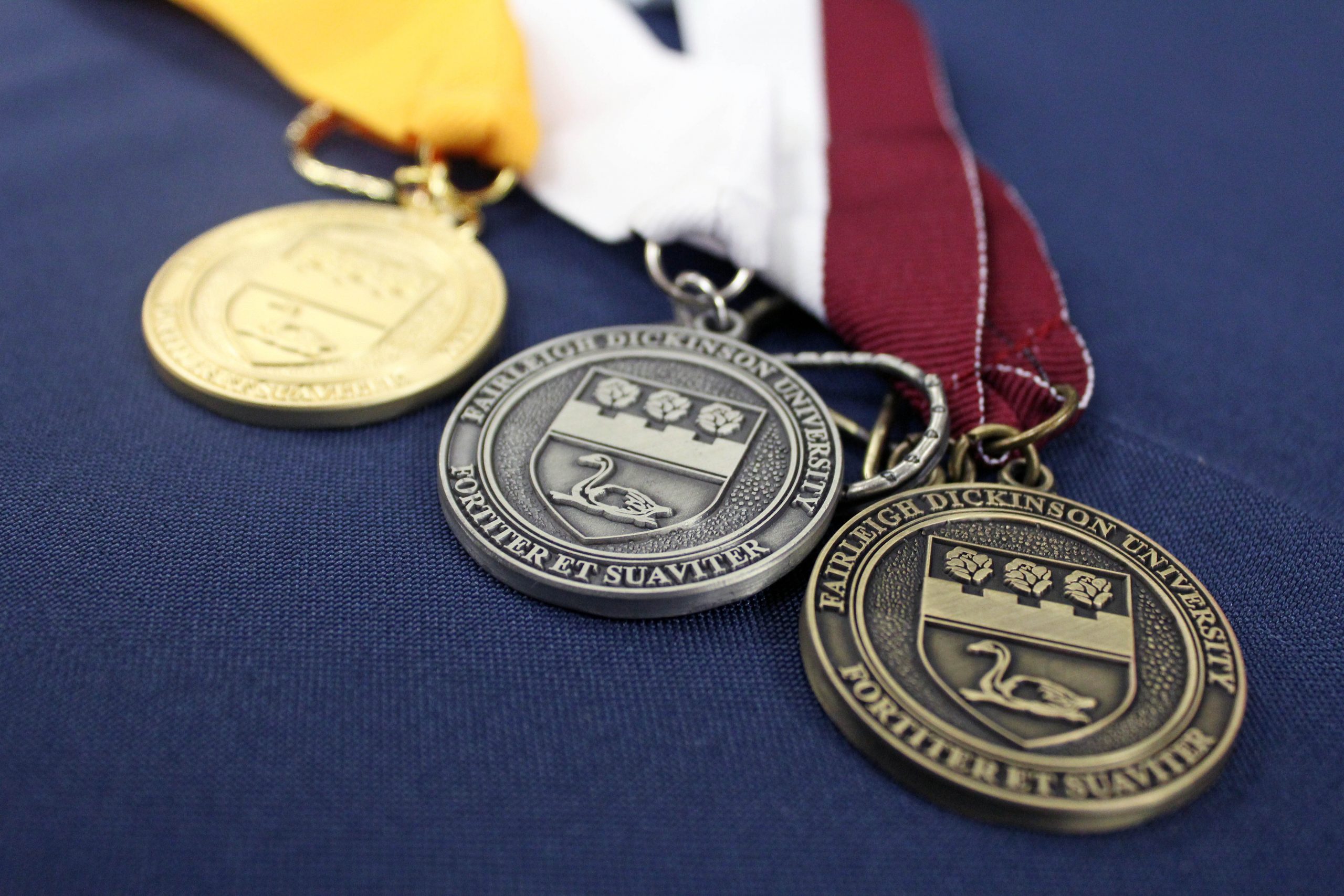 A close-up of FDU graduation medals.