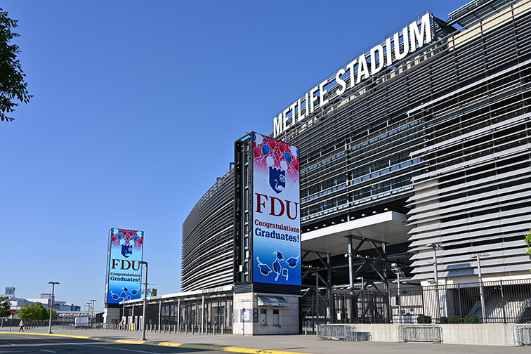 Electronic signs outside of MetLife Stadium announce FDU's graduation.