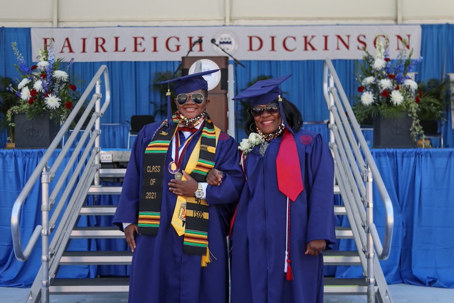 Two people in graduation robes