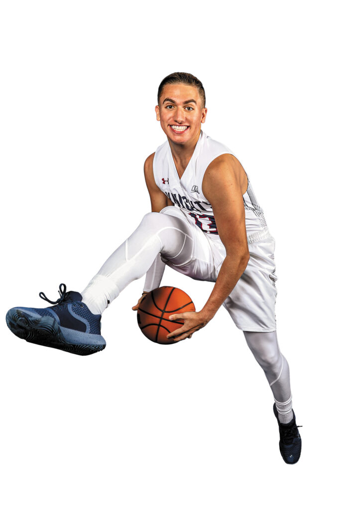 Sal Xheraj holds a basketball
