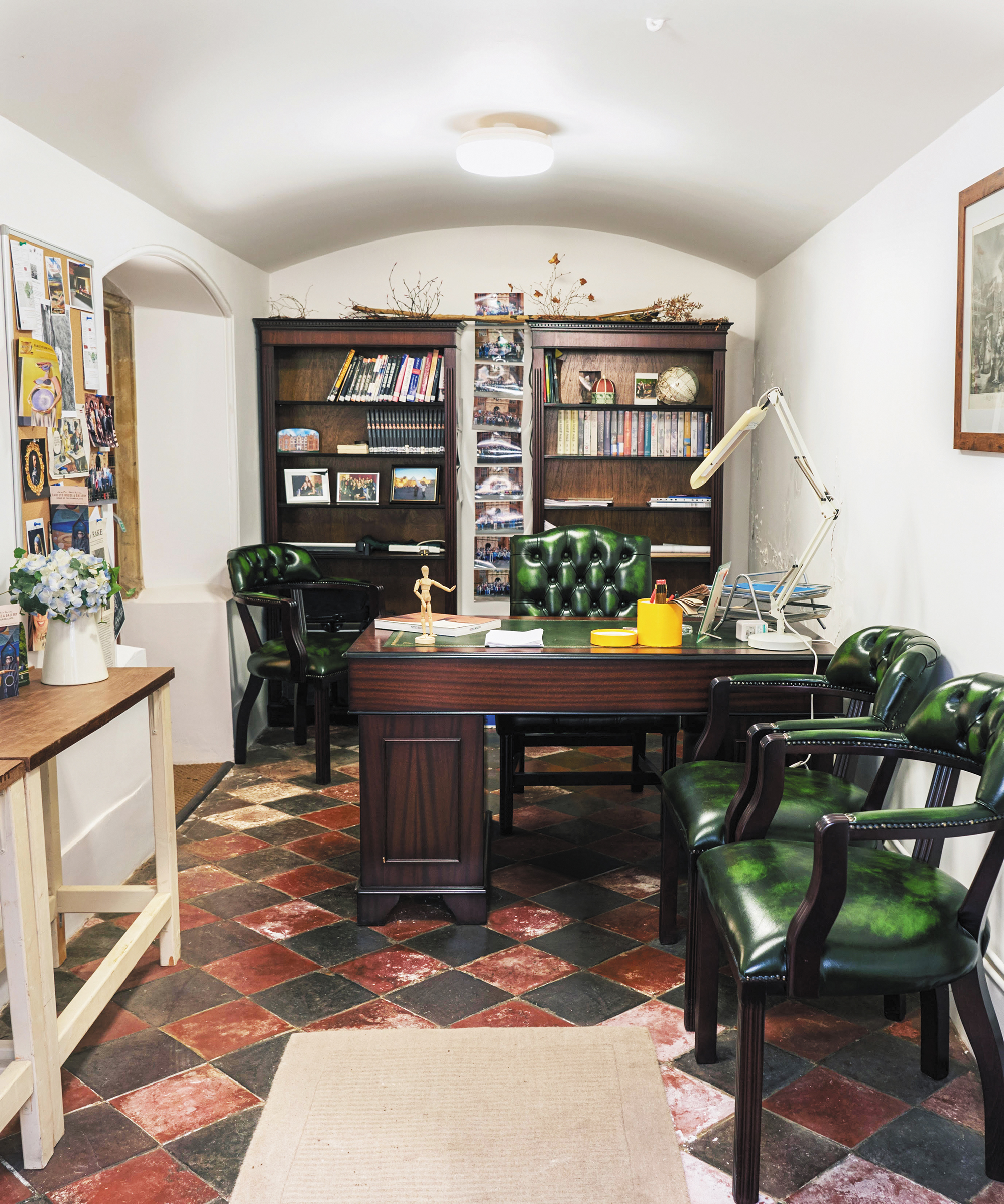 A full view photo of a unique basement office space.