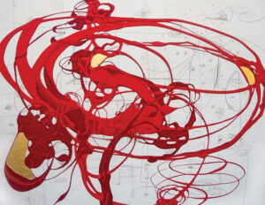 A piece of art with layers of red paint mingling with splashes of black and gold leaf on background of white.