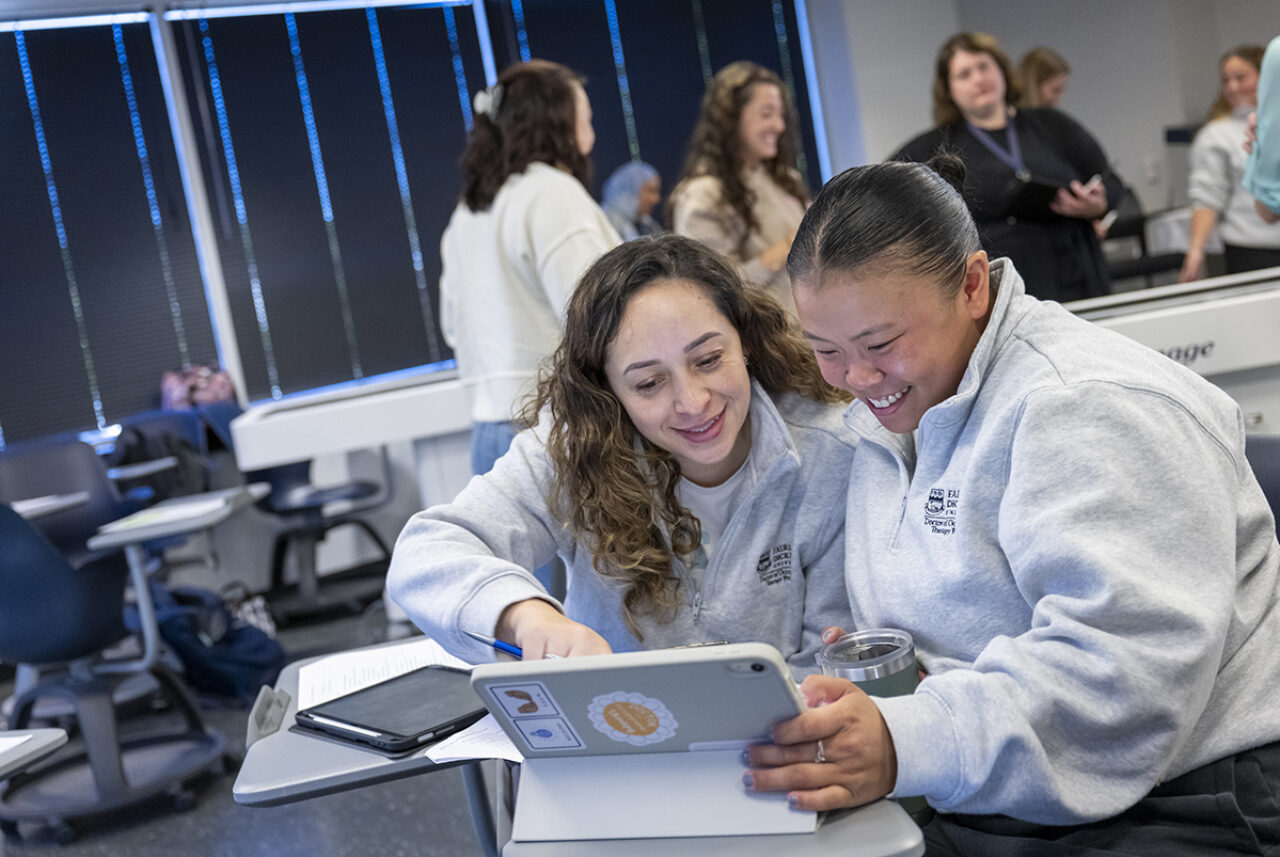 students looking at laptop