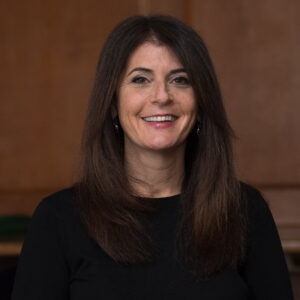 Portrait of a smiling female professor.