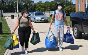 Students carry items.