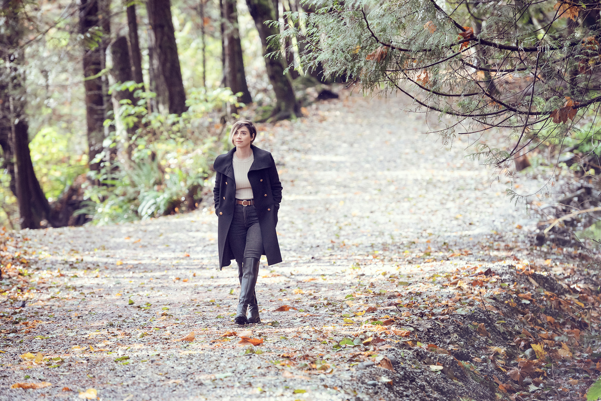 A woman walks on a trail in scenic British Columbia near Vancouver.