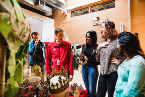 A group of people look at theatrical props