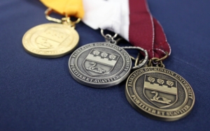A close-up of FDU graduation medals.
