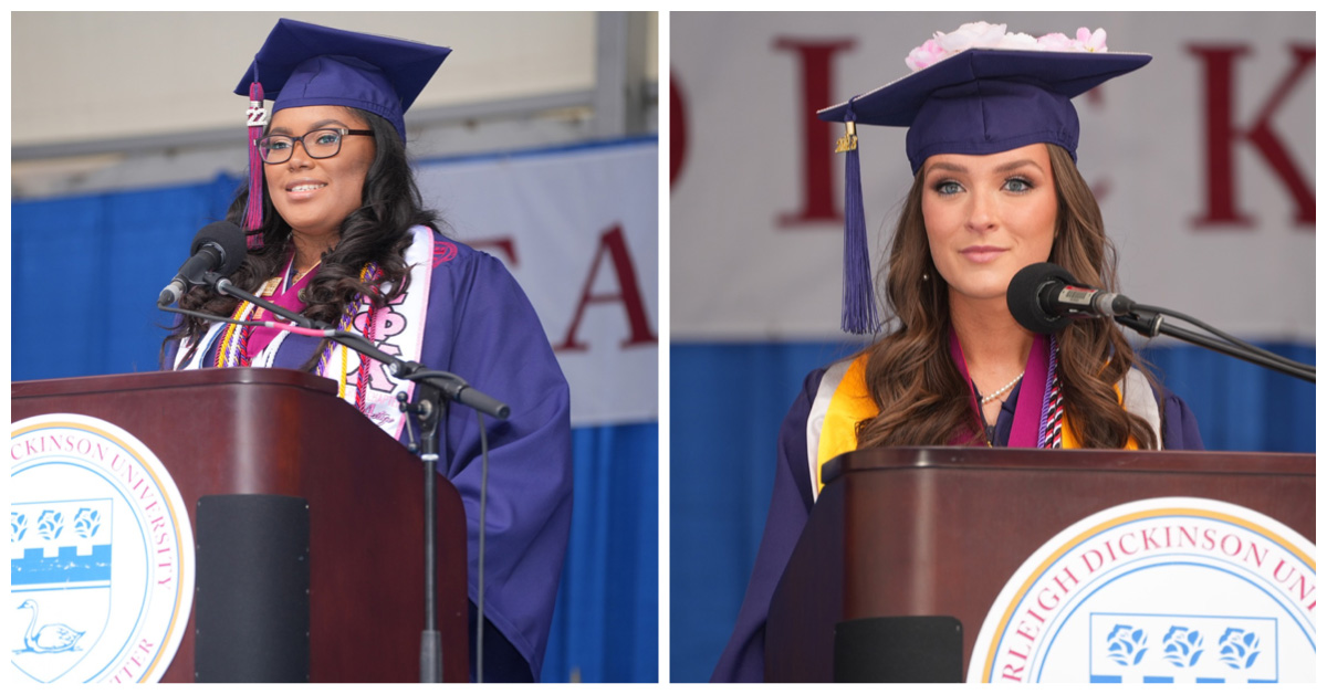Two young women in graduation regalia stand at a podium.