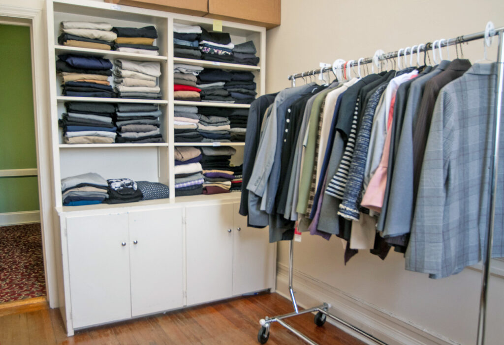 A closet in Hennessy Hall holds racks and shelves of donated business clothes for students to pick from.