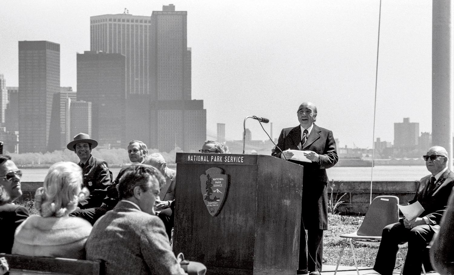 A man stands at a podium, giving a speech.