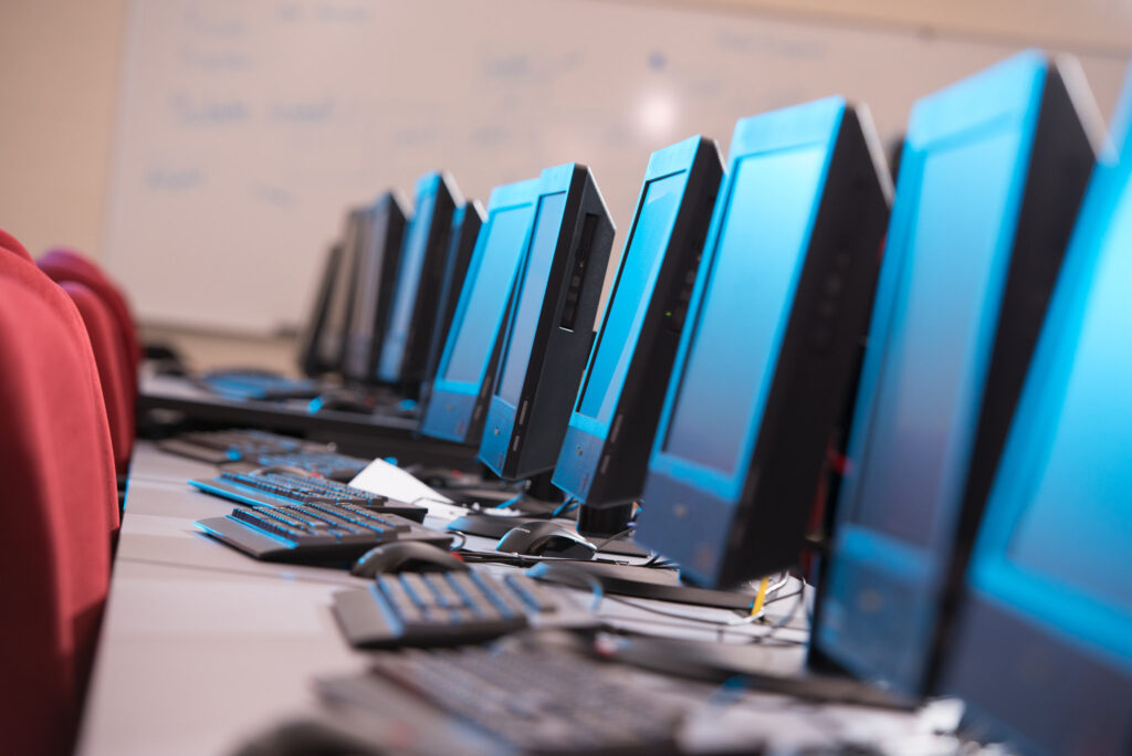 A bank of computers in a computer lab.